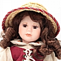 Πορσελάνινη κούκλα με καλάθι